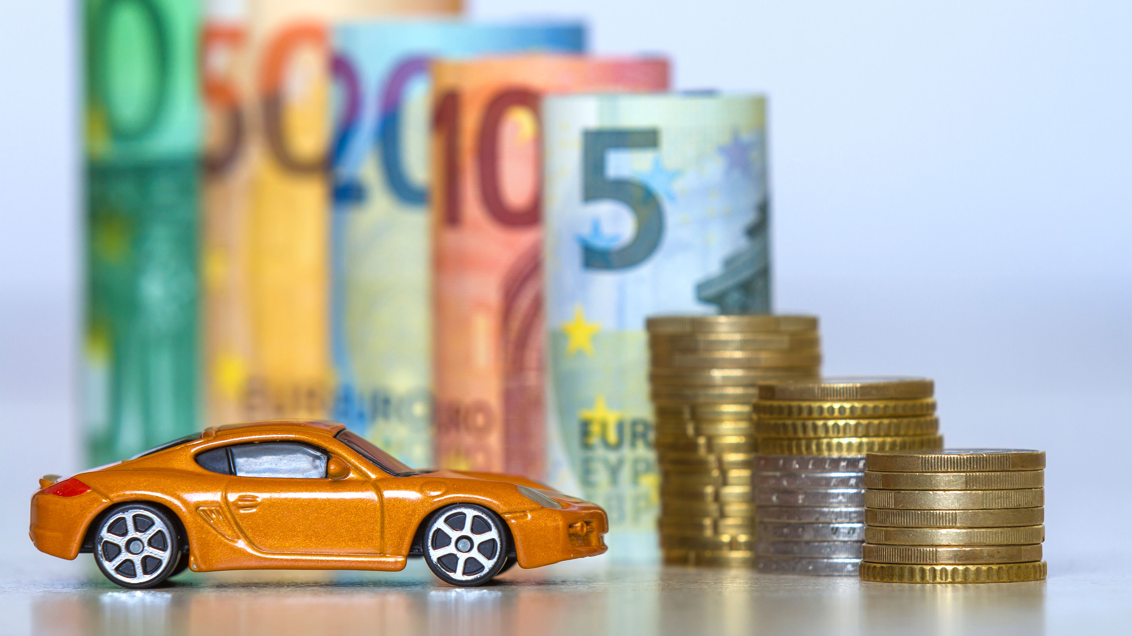 Toy car, currencies and coins 